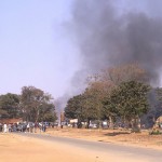 Fire at Vuwa Kaunda's estate auctioneer's office. Vuwa is the Information Minister. #July20. One of his customers' vehicle up in flames By @nyirendac