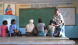Photo: Laura Lopez Gonzalez/IRIN Women and their infants wait at a short-staffed clinic in Lilongwe