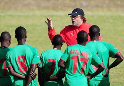 Tom Saintfeit, coach of Malawi instructs players during Malawi training