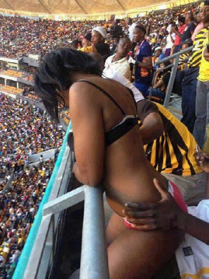 Couple captured having sex in a stadium at a music festival