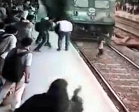 Girl Wearing Headphones is Run Over by a Train But Still Survived (Video)