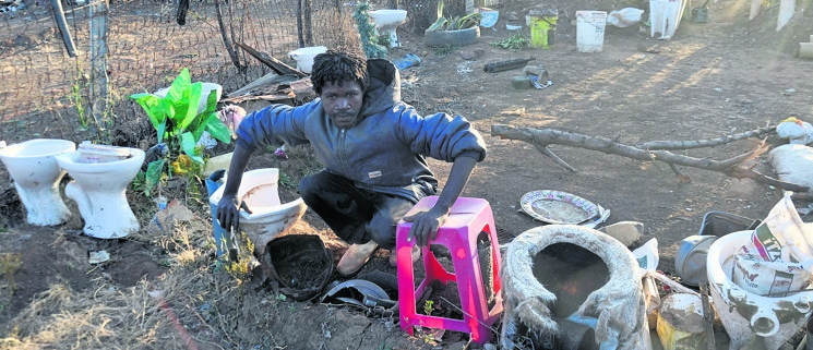 Meet a Man Who Got Saved From Witches by Gathering Toilet Seats Around His Garden