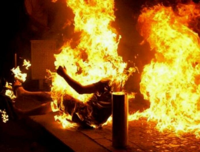 Youth set ablaze by female friend’s family members