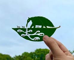 Japanese Artist Carves Whimsical Worlds into Tiny Tree Leaves