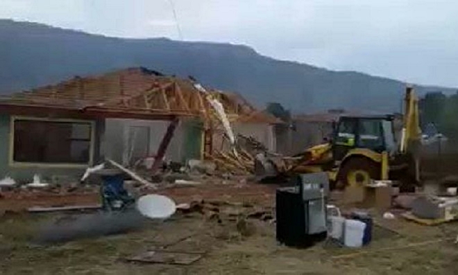 SOUTH AFRICA: Drama as angry woman demolishes family house after failed marriage (See Video)