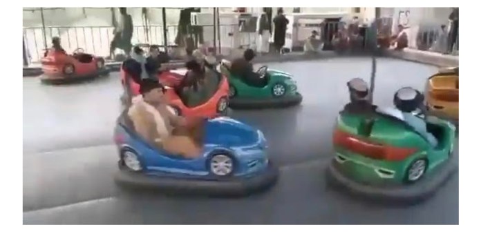Armed Taliban fighters ride dodgems in amusement park as they enjoy spoils of war after taking over Afghanistan (Photos)