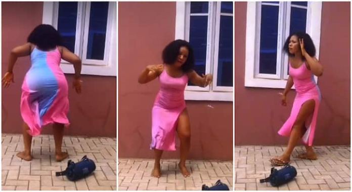 Watch| Shapely Lady in pink gown performs magical native dance steps, her waist shakes like robot