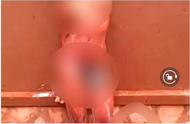 WATCH|| Female University Student Is Captured Bathing In Public, As Male Student Stirs At Her (Video)