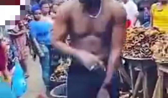Watch An Embarrassing Moment As Lady Strips Boyfriend Naked At The Market Over Cheating