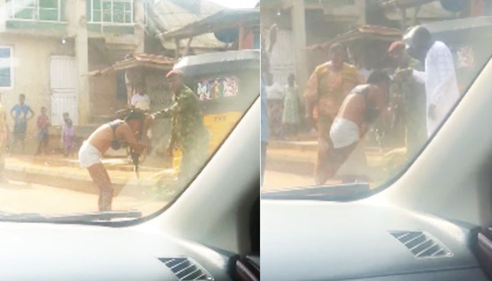 Watch|| Embarrassing moment Soldier b£ãts and str!ps lady nākked in public for ”indecent dressing”