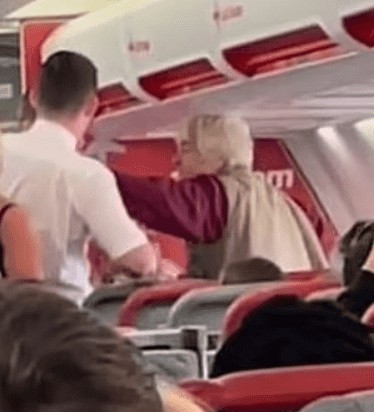 Watch As Elderly Woman Slaps Flight Steward And Pees On Seats After Her Alcoholic Drink Was Taken From Her