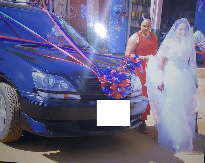 Zambian Woman Dresses Like A Bride, Stands On Roadside Waiting For A Man To Propose And Marry Her