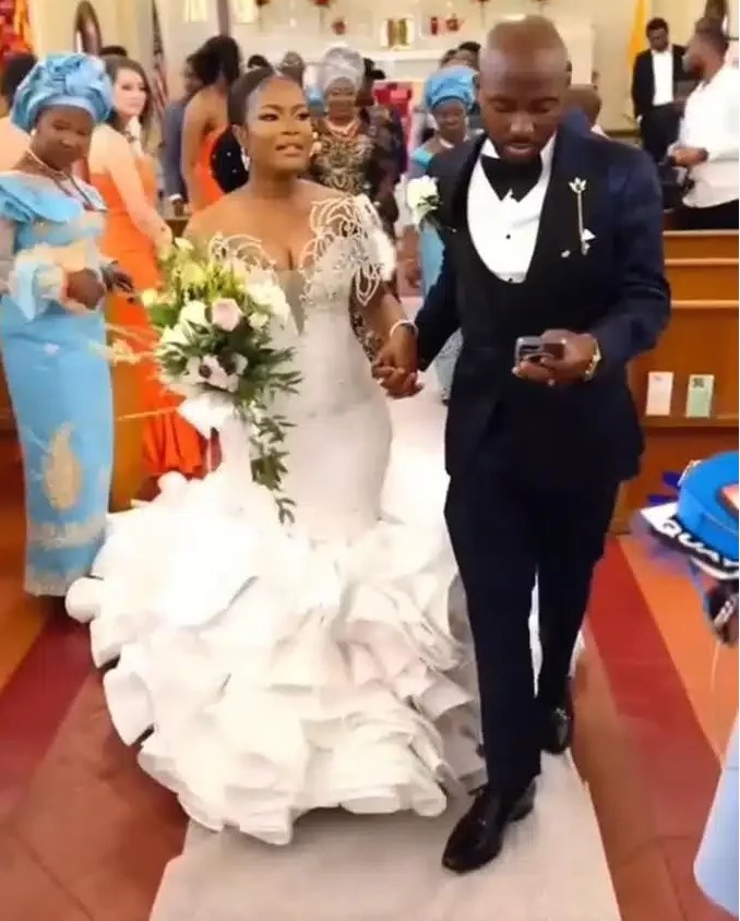 Groom Sparks Reactions After He Was Spotted Pressing Phone On The Wedding While Holding Bride’s Hand (Watch Video)