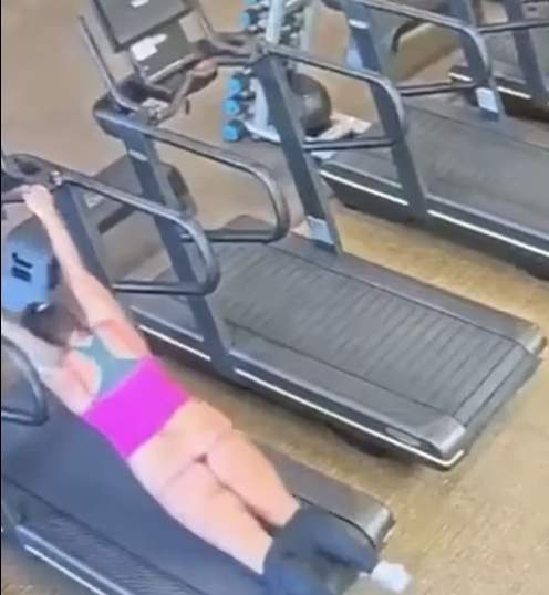 Drama as woman is stripped naked after tripping on a gym treadmill (watch video)