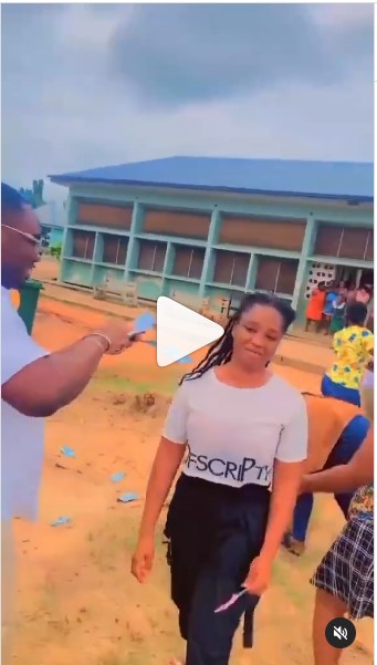 Boyfriend sprays cash on his girlfriend’s at her hostel (Watch Video)