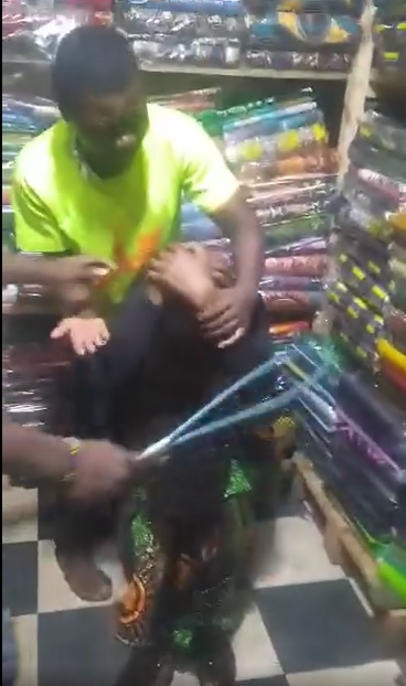 Woman beaten mercilessly after being caught red-handed stealing Chitenje (watch video)