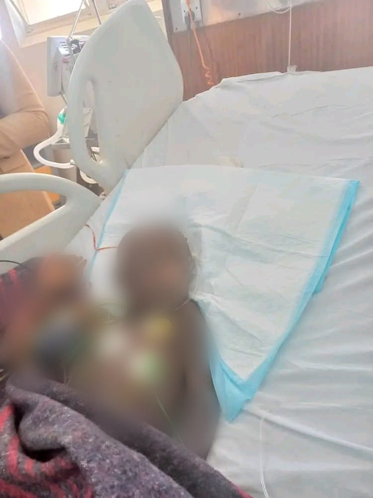 UNKNOWN GIRL HACK£D, BATTLING W0UNDS IN HOSPITAL IN ZAMBIA