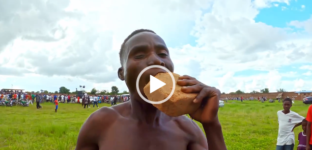 Is This Magic? Malawian Man Chewing Bricks and Glass Bottles (Watch Video)