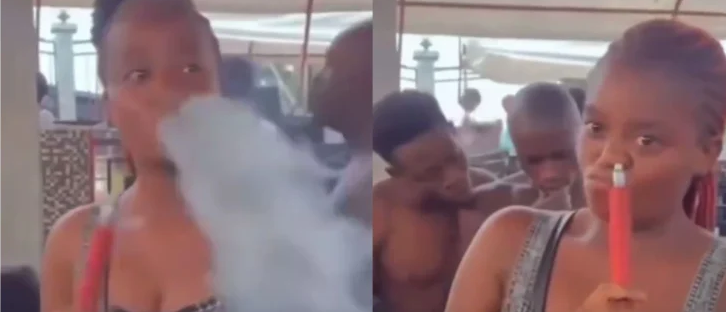 Slay-queen caught on camera smoking through the nose (Watch Video)